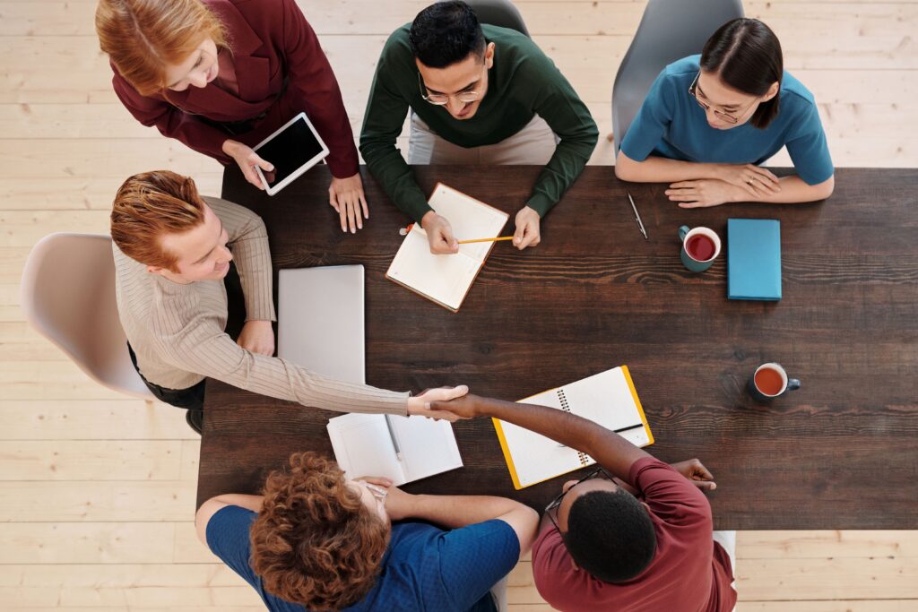 Handshake across the table during a meeting