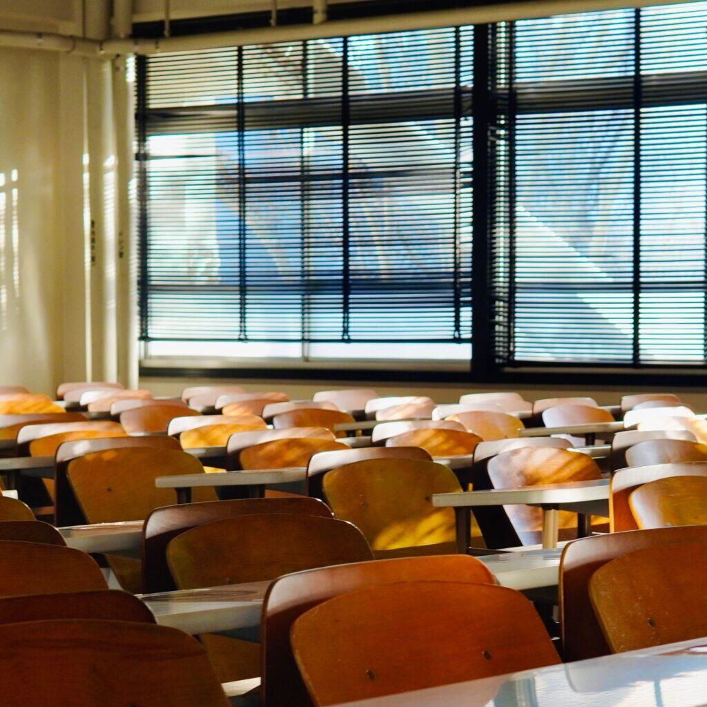 Sunlit classroom with wooden desks