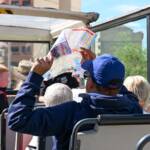 Visitors on an open-top sightseeing bus in Valencia