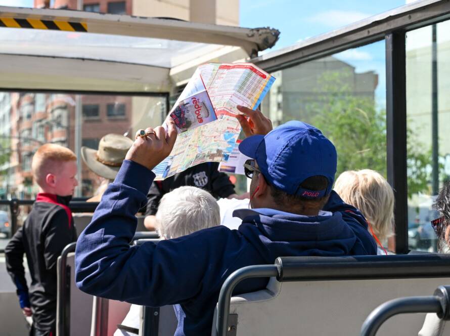 Visitors on an open-top sightseeing bus in Valencia